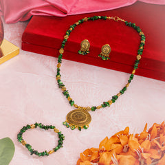 Eykaa jewelry features semi precious stone green mother of pearl beside red velvet box, silky pink fabric, and orange flowers