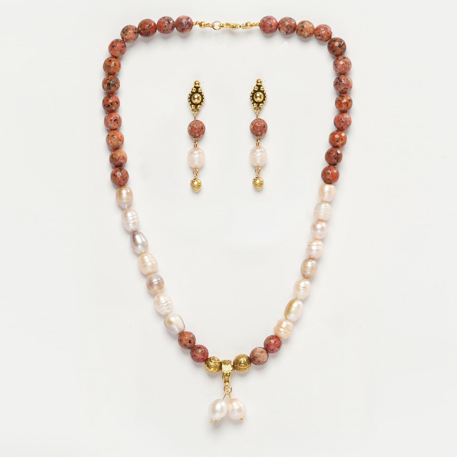 Eykaa Orange Dalmatian And Freshwater Pearl Necklace With Earrings On A White Background.