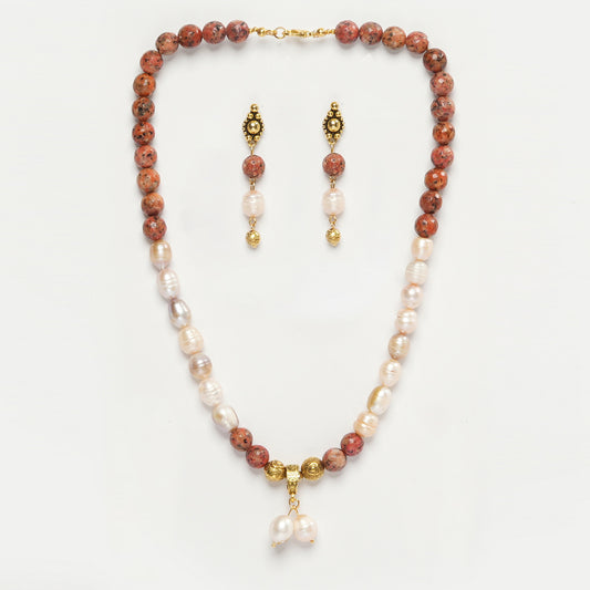 Eykaa Orange Dalmatian And Freshwater Pearl Necklace With Earrings On A White Background.