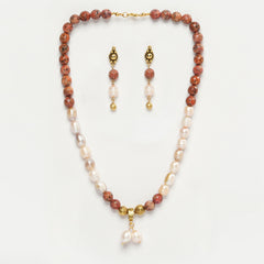 Eykaa Orange Dalmatian And Freshwater Pearl Necklace With Earrings On A White Background.