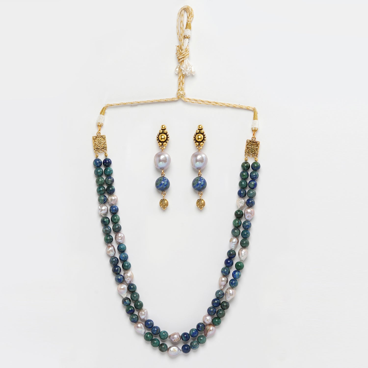 Eykaa Azurite And Freshwater Pearl Necklace With Earrings On A White Background.
Eykaa
stone jewellery
womens jewellery
earing for women
bracelet for women
necklace for women
jewellery stores