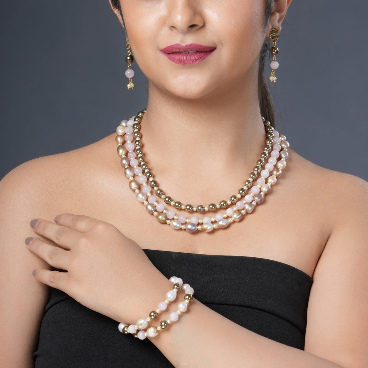 Girl Model Wearing Eykaa Layered Hematite, Rose Quartz, Freshwater Pearl, And Shell Pearl Necklace With Earrings And A Bracelet.
Eykaa
stone jewellery
womens jewellery
earing for women
bracelet for women
necklace for women
jewellery stores