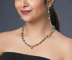 Girl model wearing Eykaa green aventurine, golden hematite and shell pearls semi precious stone necklace and earrings