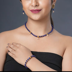 Girl model wearing Eykaa necklace, earrings and bracelet that features semi precious stone amethyst, golden hematite and bead