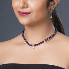 Girl model wearing Eykaa necklace and  earrings that features semi precious stone amethyst, golden hematite and bead