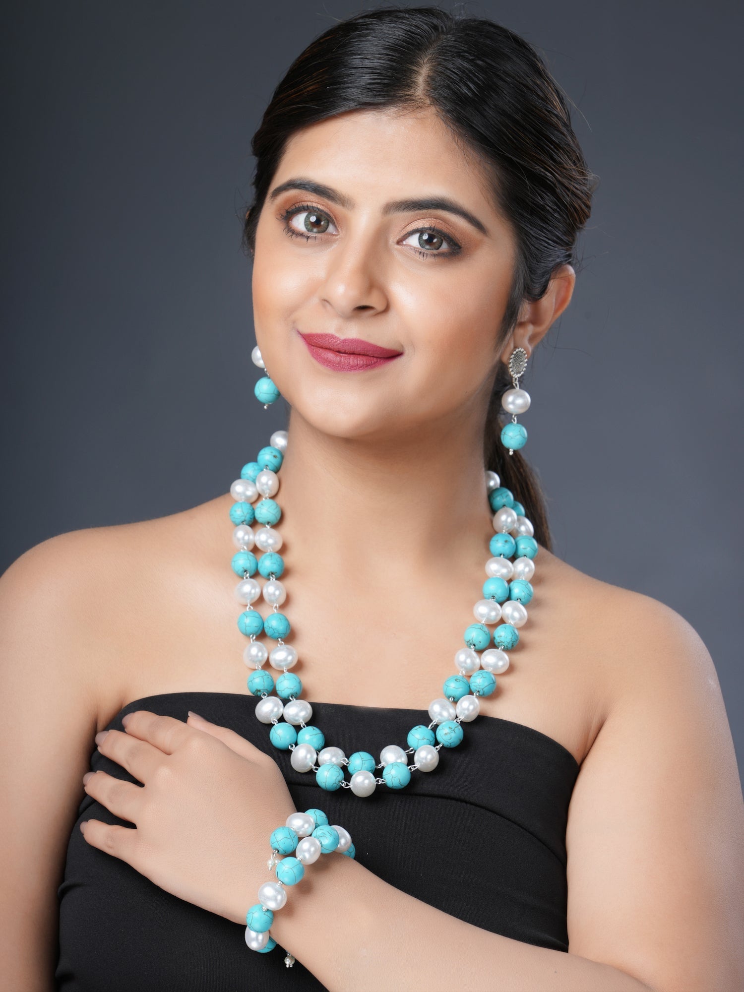 Girl Model Wearing Eykaa Firoza With Korean Pearl Balls Layered Necklace With Earrings And A Bracelet.
Eykaa
stone jewellery
womens jewellery
earing for women
bracelet for women
necklace for women
jewellery stores