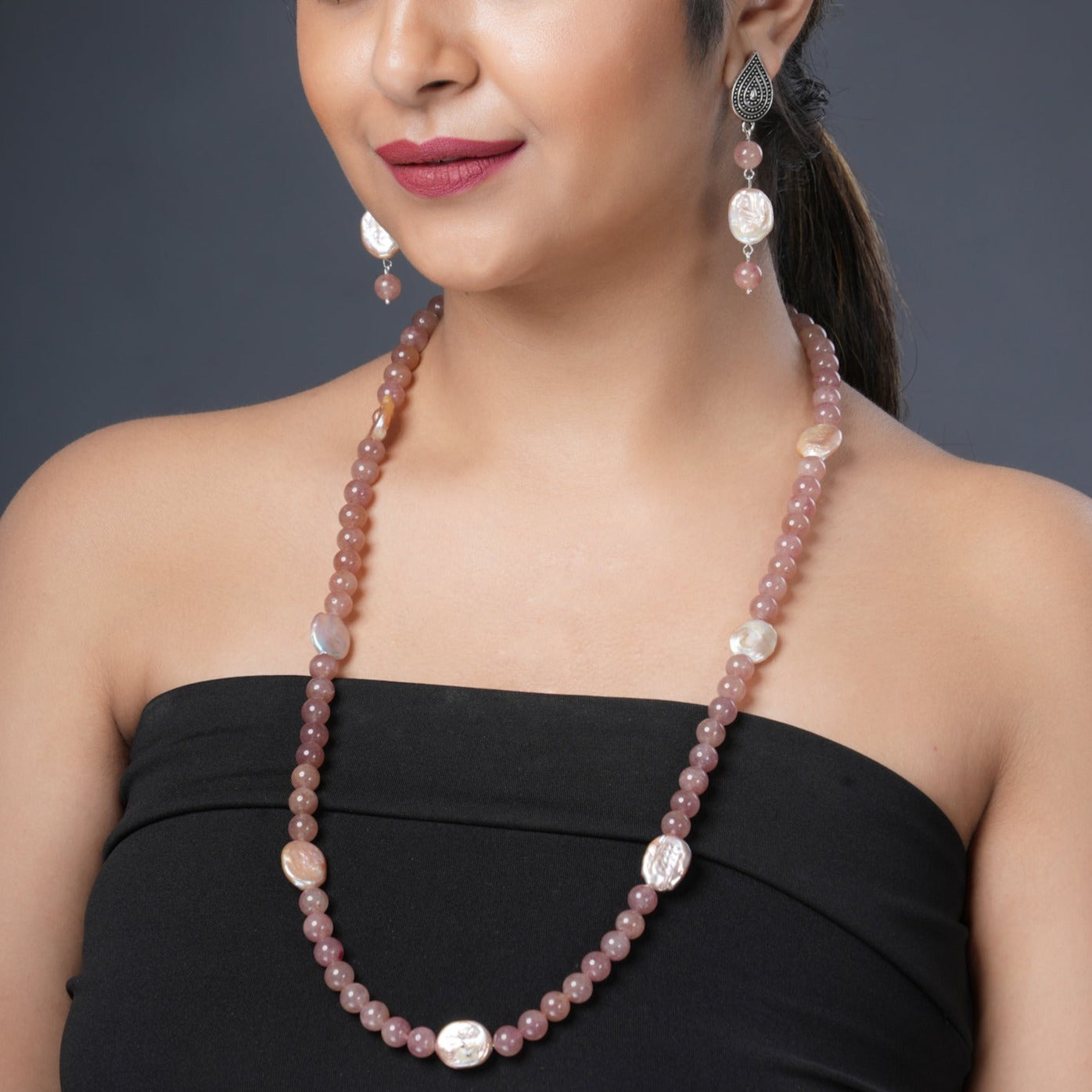 Girl Model Wearing Eykaa Strawberry Quartz And Freshwater Pearl Necklace With Earrings.
Eykaa
stone jewellery
womens jewellery
earing for women
bracelet for women
necklace for women
jewellery stores