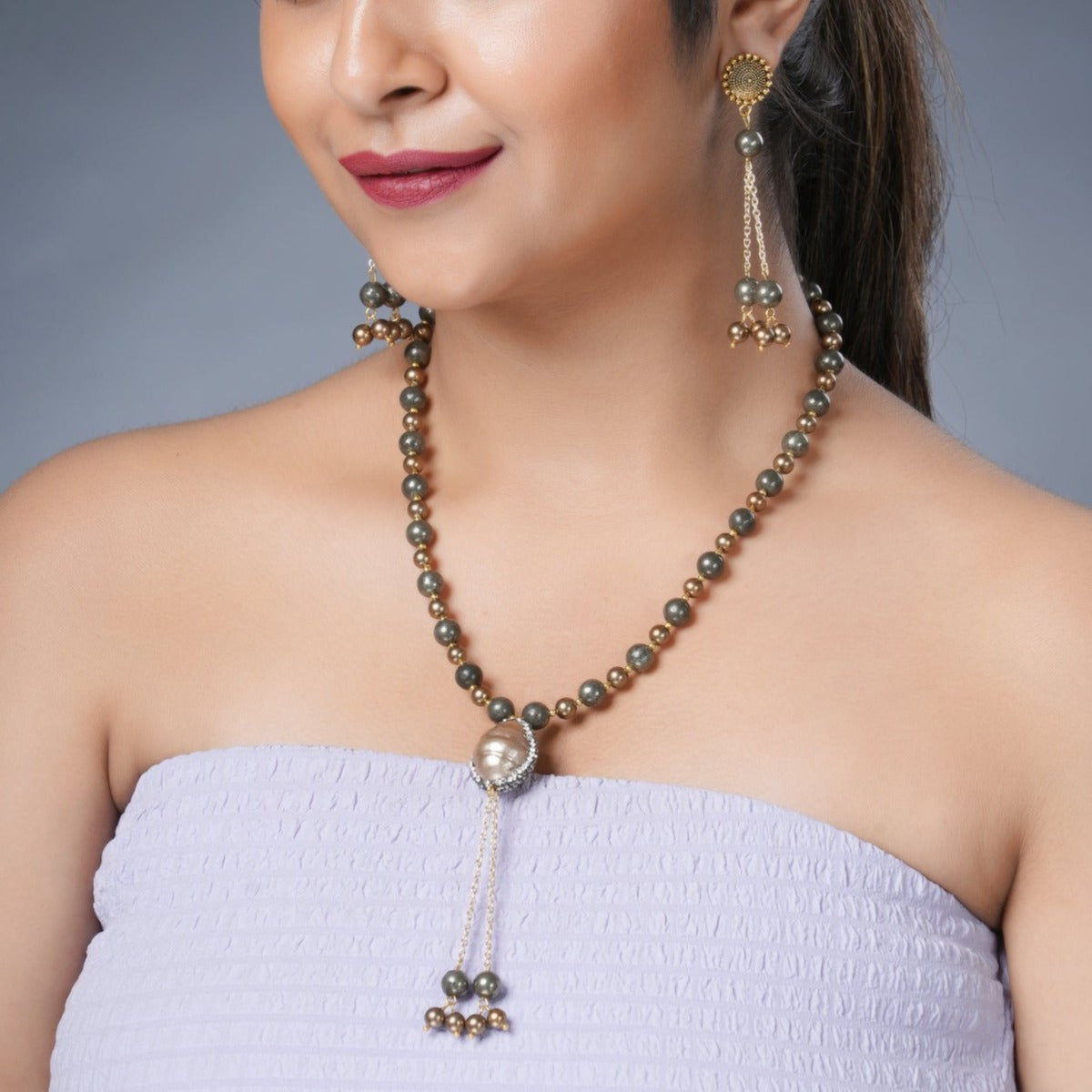 Girl Model Wearing Eykaa Pyrite With Shell Pearls And Shell Pearl Pendant Necklace With Earrings.