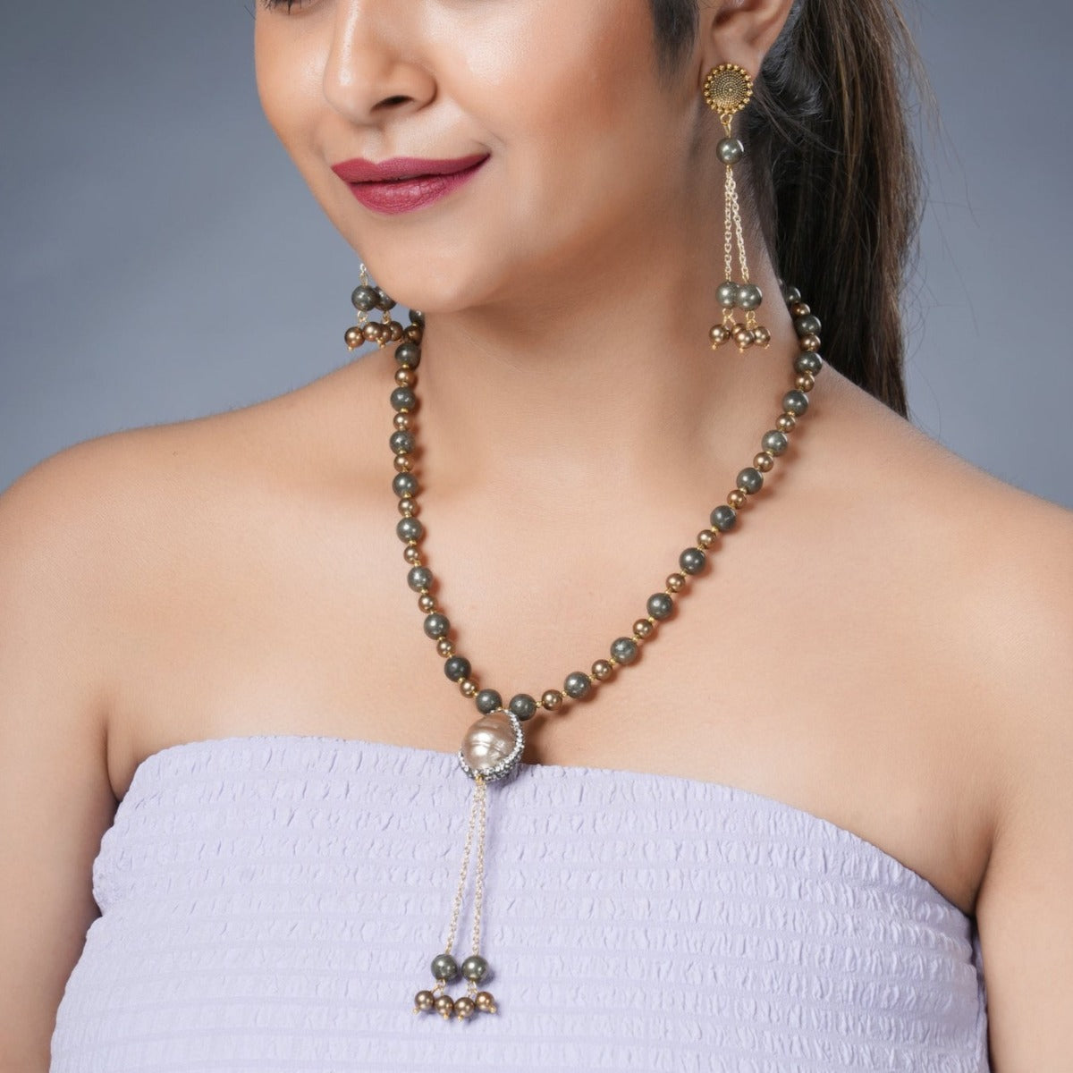 Girl Model Wearing Eykaa Pyrite With Shell Pearls And Shell Necklace With Earrings.
