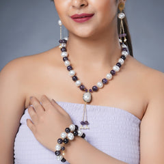 Girl Model Wearing Eykaa Amethyst with Pearl Korean Balls and Shell Pearl Pendant Necklace with Earrings and a Bracelet.