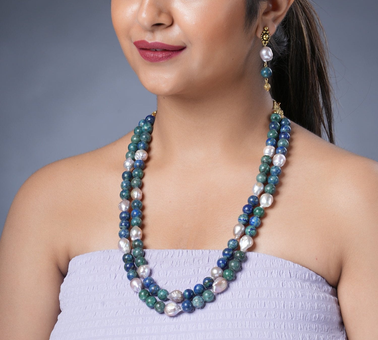 Girl Model Wearing Eykaa Azurite And Freshwater Pearl Necklace With Earrings.
Eykaa
stone jewellery
womens jewellery
earing for women
bracelet for women
necklace for women
jewellery stores