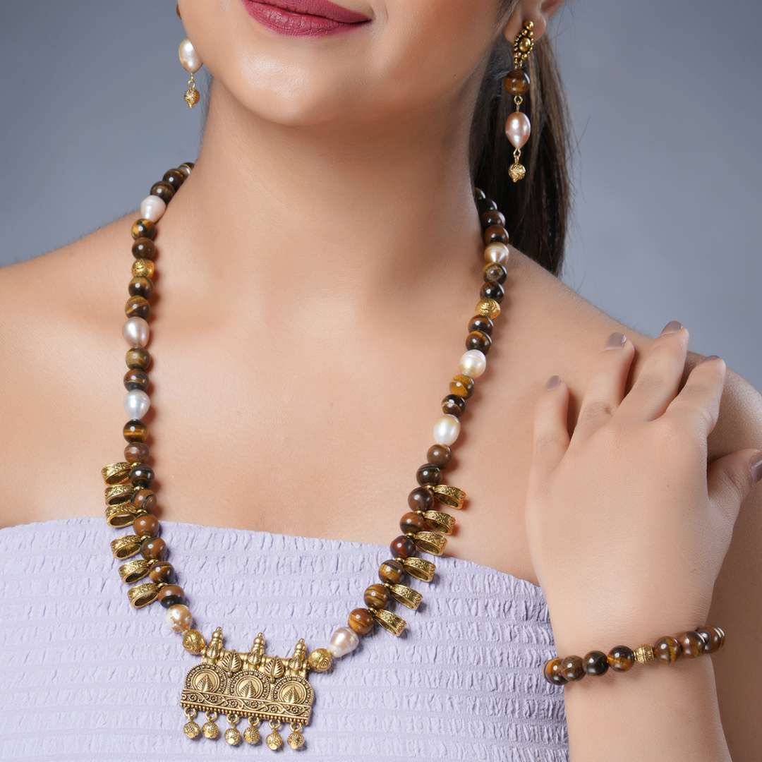 Girl Model Wearing Eykaa Freshwater Pearl And Tiger Eye Necklace With Earrings And Bracelet.
Eykaa
stone jewellery
womens jewellery
earing for women
bracelet for women
necklace for women
jewellery stores