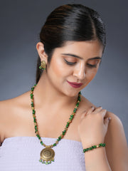 Girl model wearing Eykaa necklace, earrings and bracelet that features EYKAA GREEN MOTHER OF PEARL WITH GOLDEN CHARMS AND PENDANT BRACELET | I-B-919020