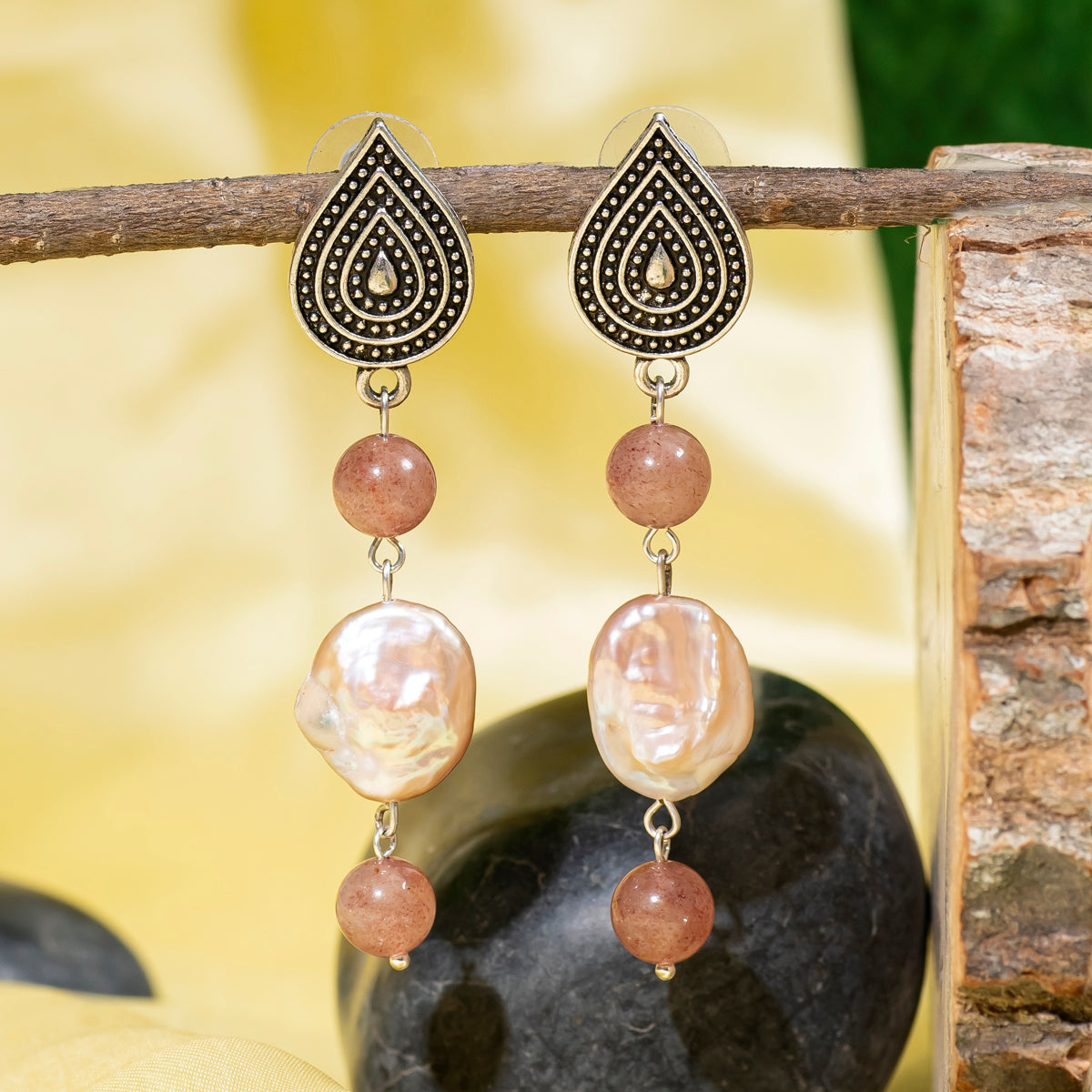 Eykaa Strawberry Quartz and Freshwater Pearl Earrings Hanging on the Tree Branch.