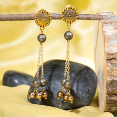Eykaa Pyrite With Shell Pearls Earrings Hanging On The Tree Branch.