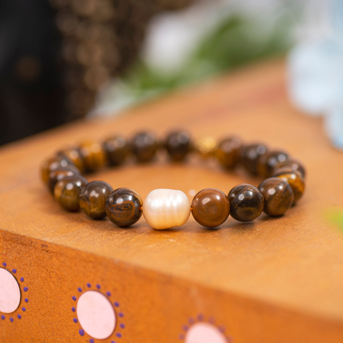 Eykaa Freshwater Pearl And Tiger Eye Necklace Bracelet Displayed On A Textured Orange Surface.
Eykaa
stone jewellery
womens jewellery
earing for women
bracelet for women
necklace for women
jewellery stores