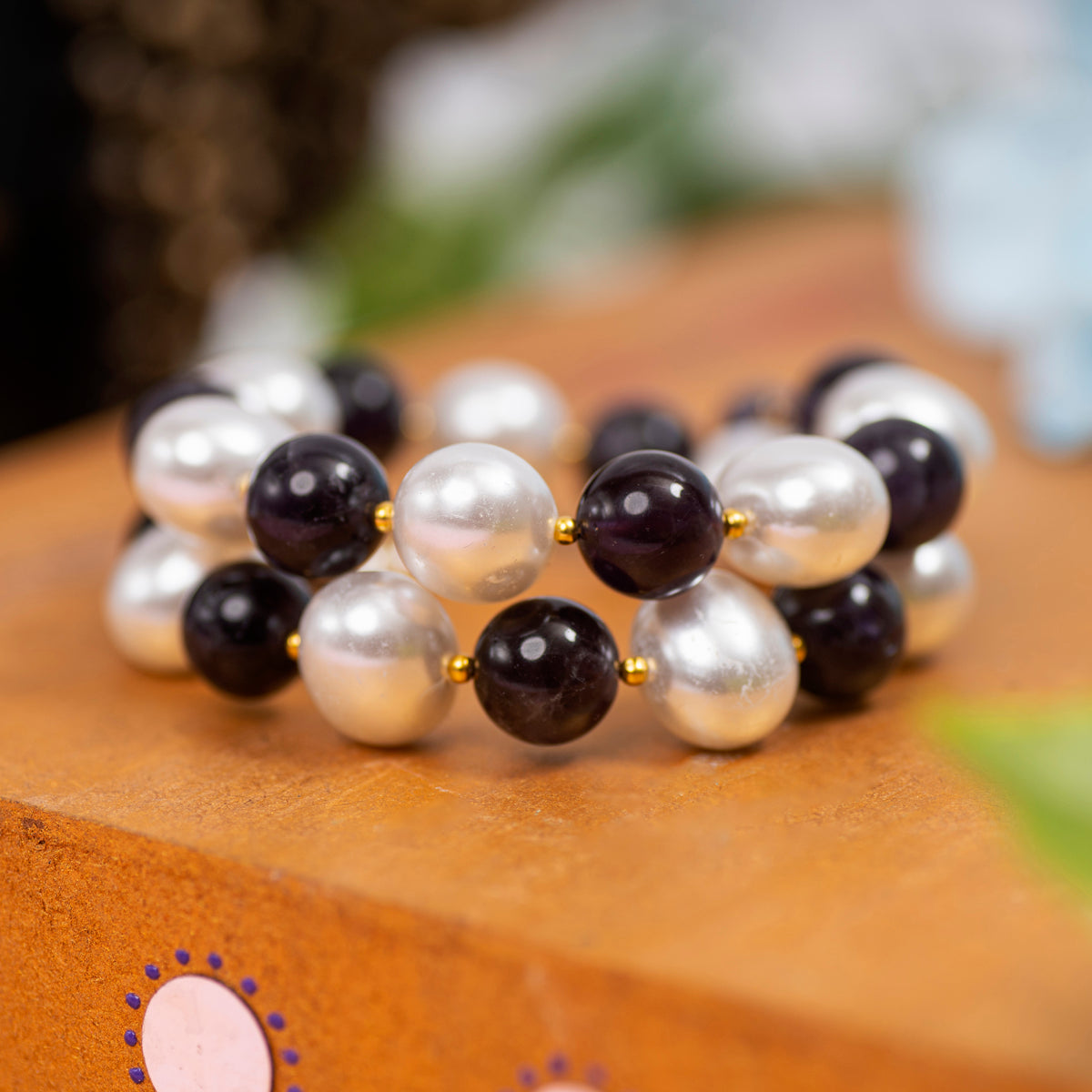 Eykaa Amethyst With Korean Pearl Balls And Shell Pearl Pendant Bracelet Displayed On A Textured Orange Surface.
Eykaa
stone jewellery
womens jewellery
earing for women
bracelet for women
necklace for women
jewellery stores