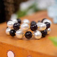 Eykaa Amethyst With Korean Pearl Balls And Shell Pearl Pendant Bracelet Displayed On A Textured Orange Surface.
Eykaa
stone jewellery
womens jewellery
earing for women
bracelet for women
necklace for women
jewellery stores