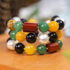 Eykaa Black Obsidian, Red Jasper, Green Jade, Yellow Jade, And Korean Pearl Bracelet Displayed On A Textured Orange Surface.
Eykaa
stone jewellery
womens jewellery
earing for women
bracelet for women
necklace for women
jewellery stores