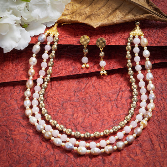 Eykaa Layered Hematite, Rose Quartz, Freshwater Pearl, And Shell Pearl Necklace With Earrings On A Textured Red Background With White Flowers.
Eykaa
stone jewellery
womens jewellery
earing for women
bracelet for women
necklace for women
jewellery stores