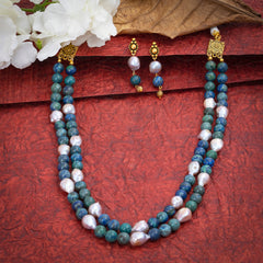 Eykaa Azurite And Freshwater Pearl Necklace With Earrings On A Textured Red Background With White Flowers.
Eykaa
stone jewellery
womens jewellery
earing for women
bracelet for women
necklace for women
jewellery stores