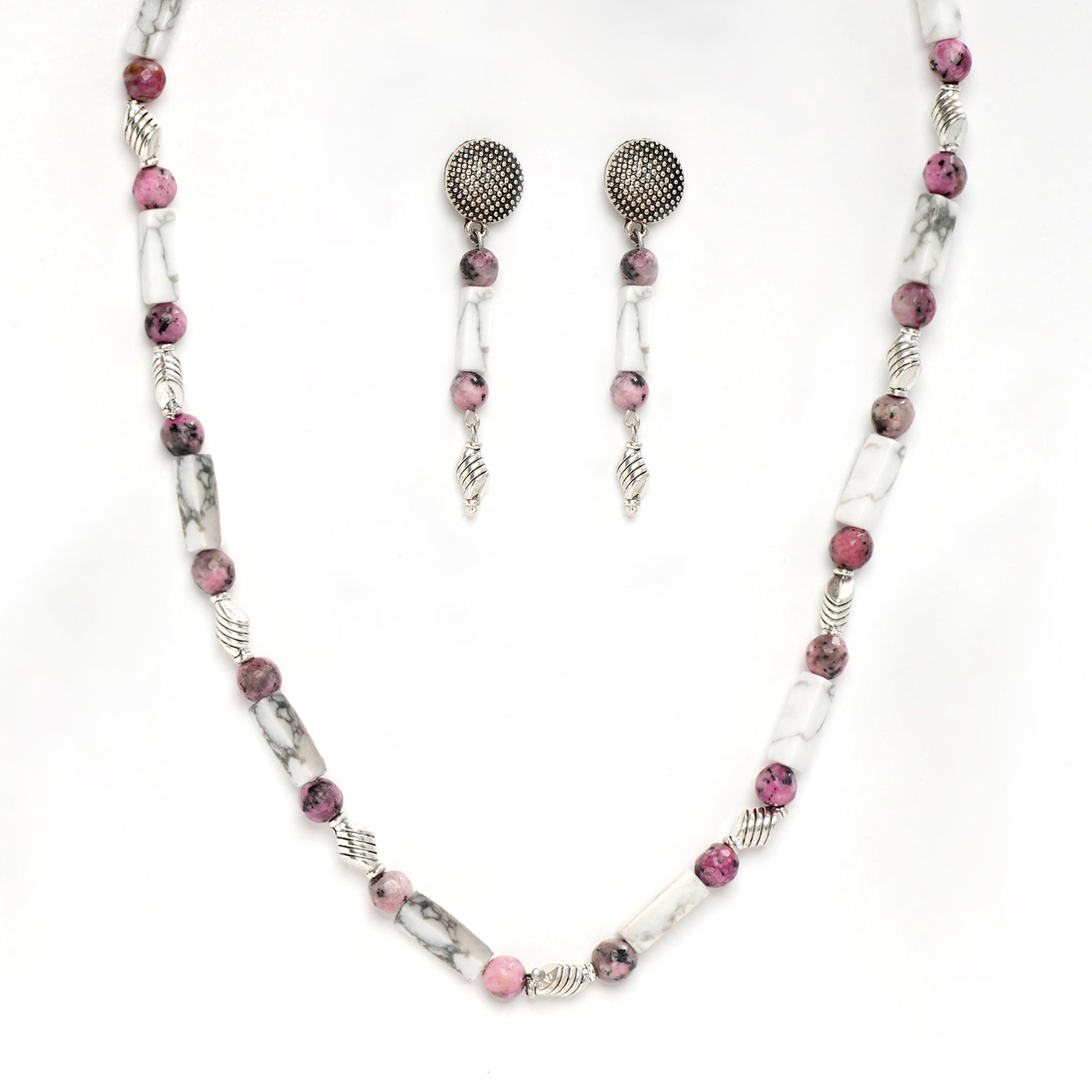 Eykaa white howlite with dalmatian and silver charms semi precious stone necklace and earrings on white background.