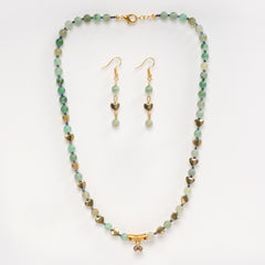 Eykaa green aventurine, golden hematite and shell pearls semi precious stone necklace and earrings on white background.