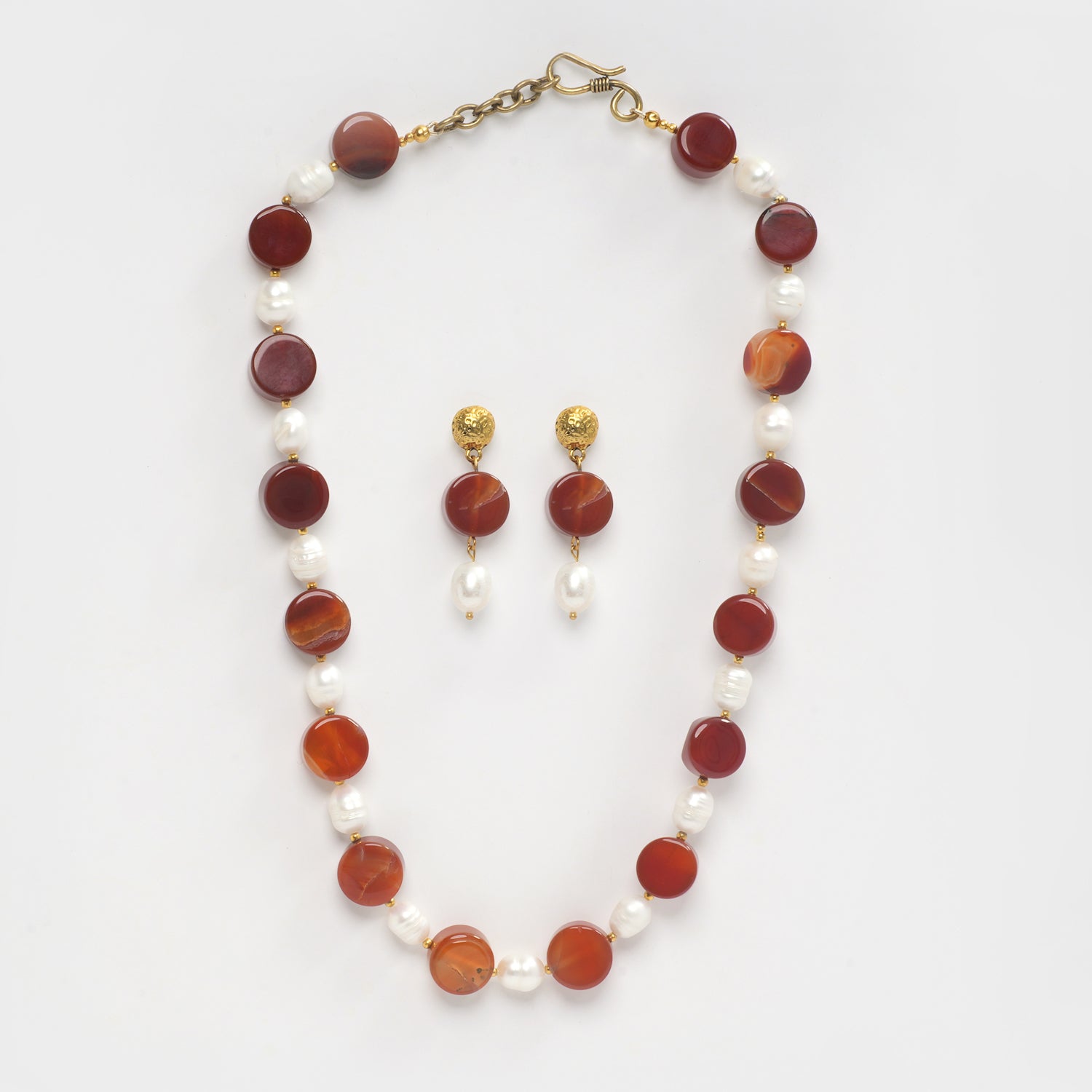 Eykaa Carnelian And Freshwater Pearl Necklace With Earrings On A White Background.
Eykaa
stone jewellery
womens jewellery
earing for women
bracelet for women
necklace for women
jewellery stores