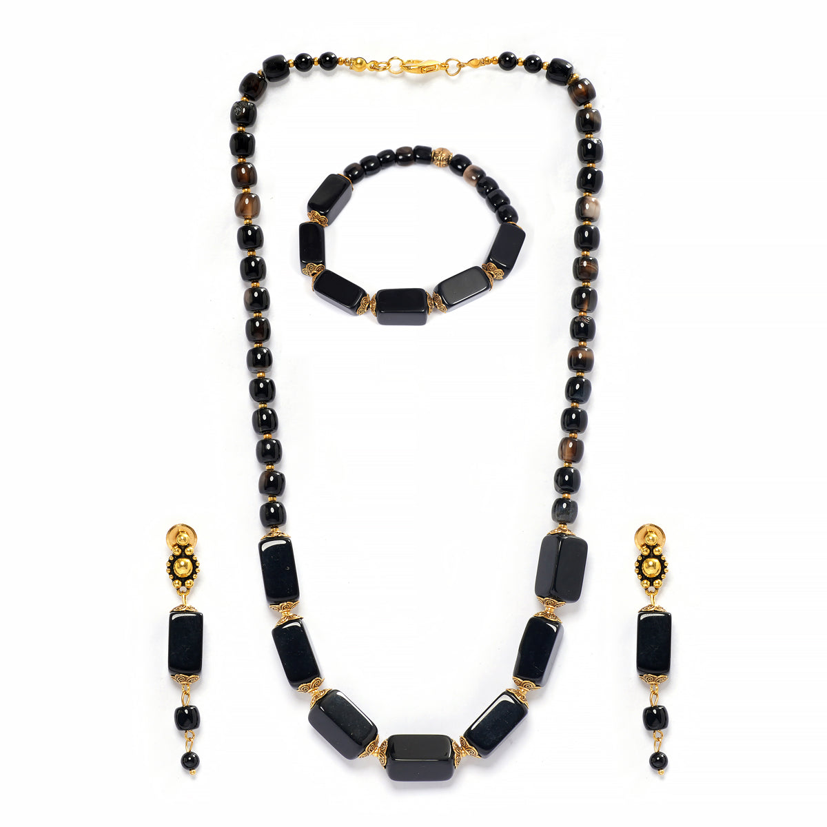 Eykaa brand necklace, bracelet and earrings that feature semi precious stone black onyx with hakik on a white background. 