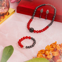 Eykaa Jade With Black Tourmaline And Hematite Necklace With Earrings And A Bracelet On A Pink Marbled Surface, Arranged On And Around A Red Velvet Box, Surrounded By Orange Flowers And Green Leaves.

Eykaa
stone jewellery
womens jewellery
earing for women
bracelet for women
necklace for women
jewellery stores