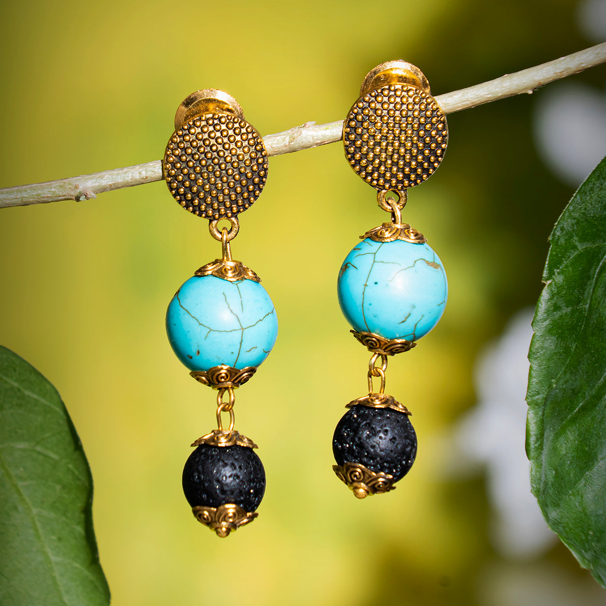 Eykaa Firoza And Lava With Golden Charms Earrings Hanging On The Tree Branch.