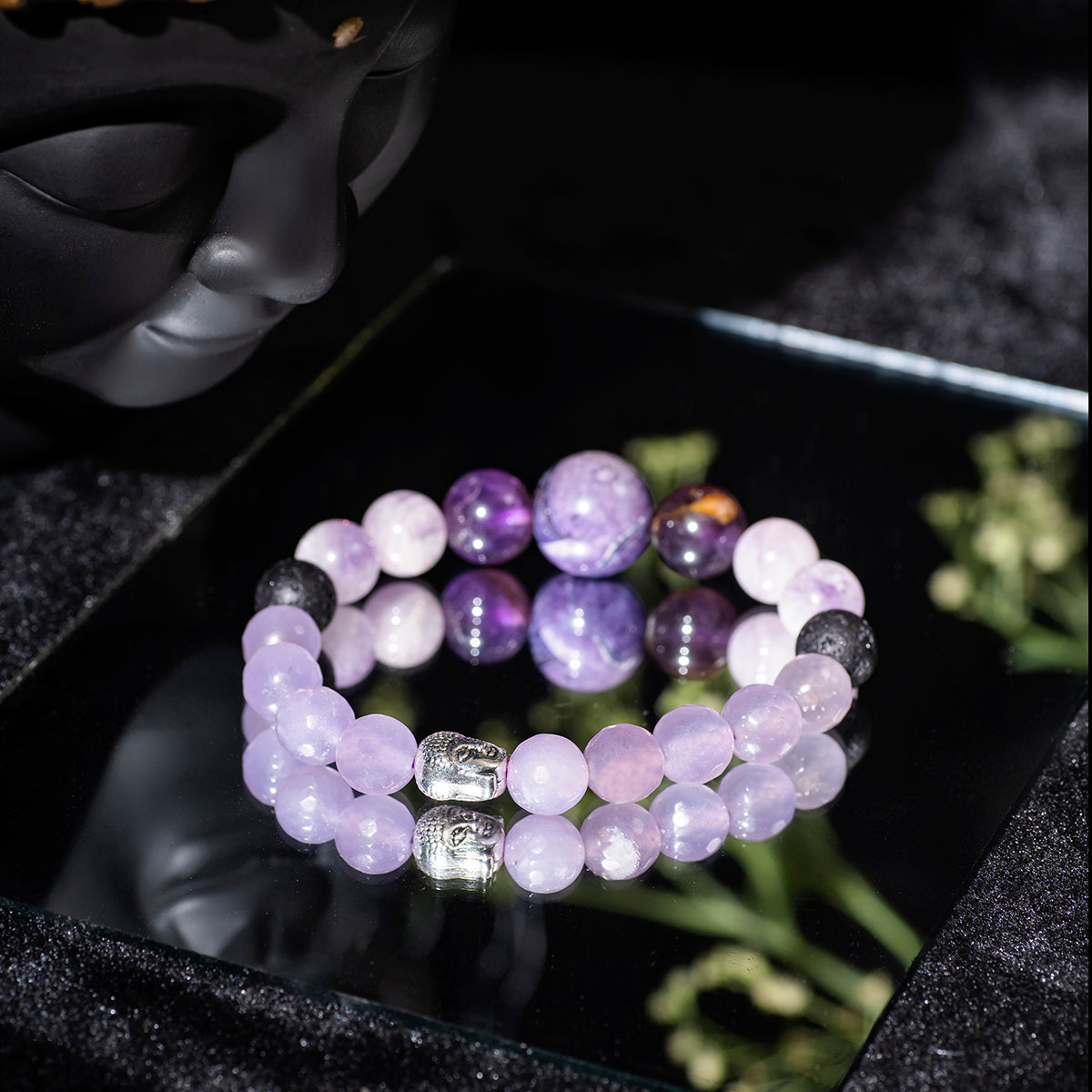 Eykaa faceted jade with kunzite and amethyst semi precious stone with silver beads bracelet on mirror surface.