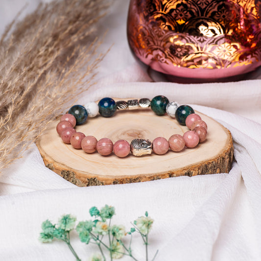 Eykaa Orange Aventurine And Indian Agate Bracelet On A Rustic Wooden Slice.