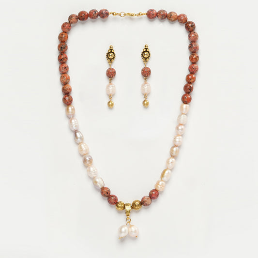  Eykaa Orange Dalmatian And Freshwater Pearl Necklace With Earrings On A White Background.