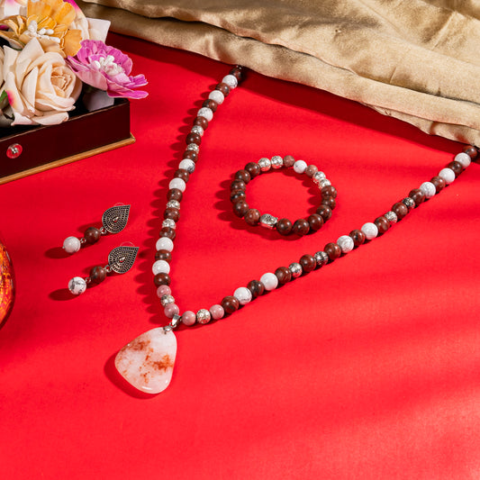 Eykaa Red Jasper, Silver Lava With White Howlite Necklace With Agate Pendant, Earrings And Bracelet On A Vibrant Red Surface