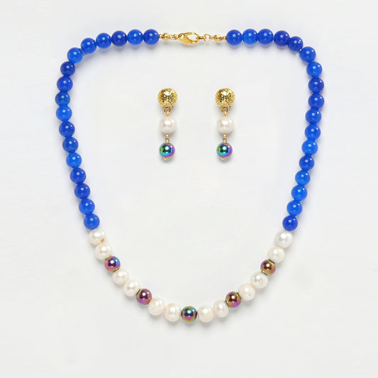 Eykaa Blue Onyx, Rainbow Hematite, And Freshwater Pearl Necklace With Earrings On A White Background.