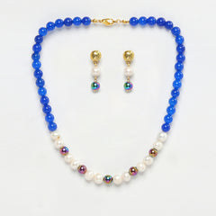 Eykaa Blue Onyx, Rainbow Hematite, And Freshwater Pearl Necklace With Earrings On A White Background.