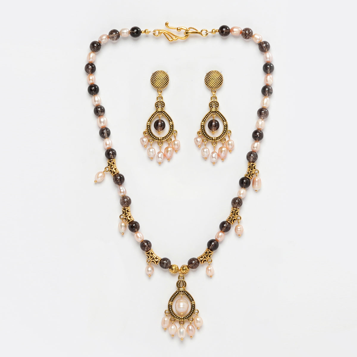 Eykaa Smokey Quartz And Fresh Water Pearl Necklace With Earrings And A Bracelet On A White Background.