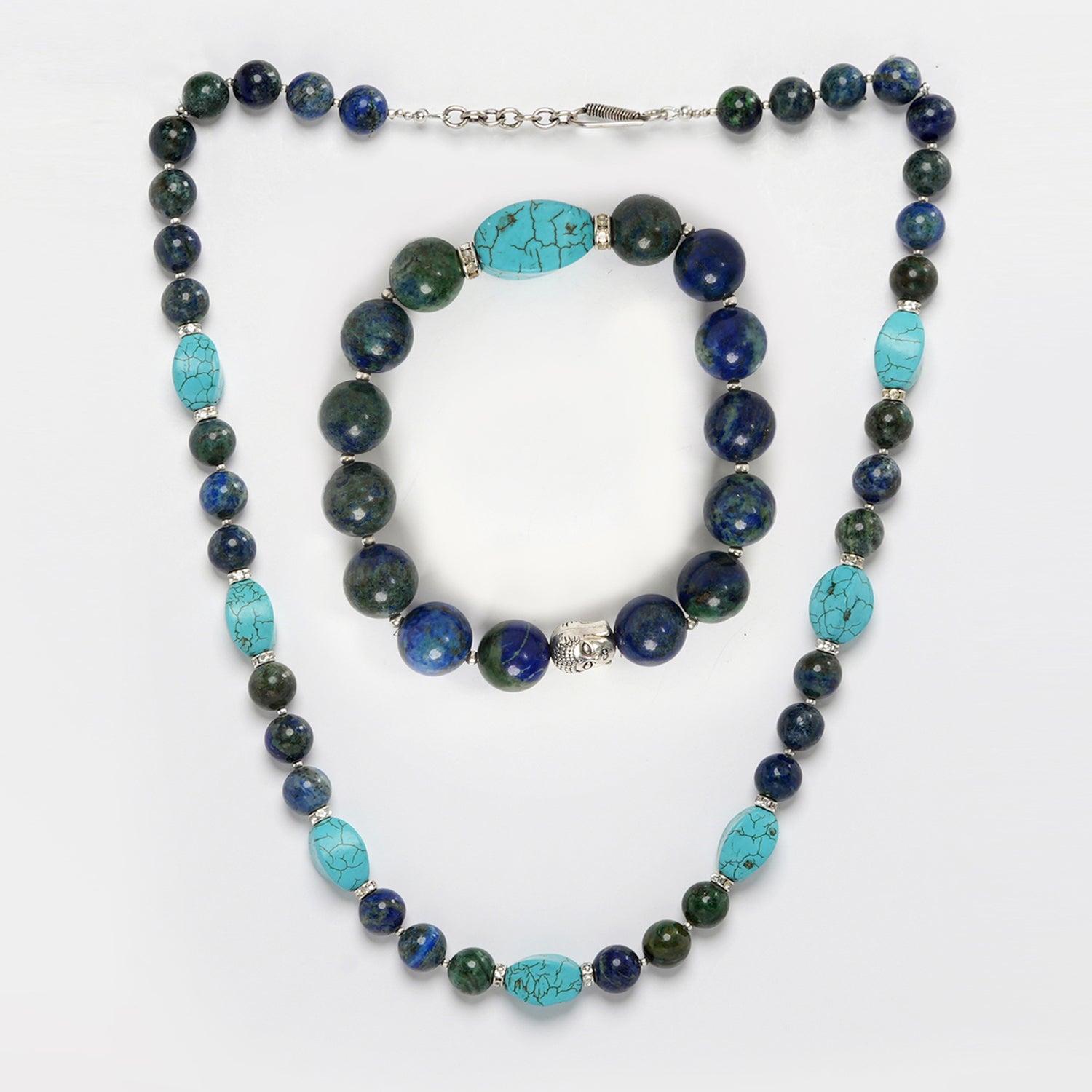 Eykaa brand necklace, earrings and bracelet feature azurite with firoza and silver beads  on white background.