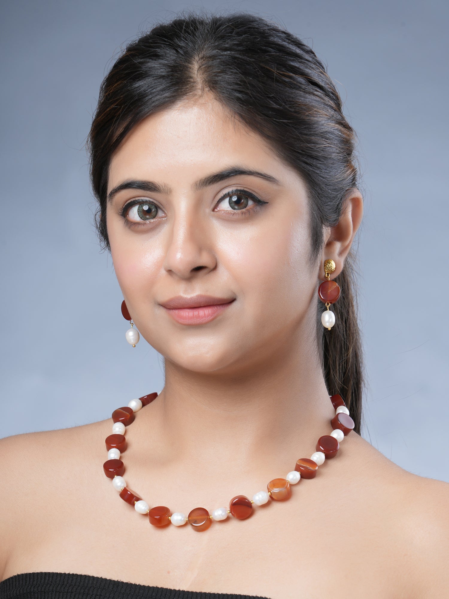 Girl Model Wearing Eykaa Carnelian And Freshwater Pearl Necklace With Earrings.

Eykaa
stone jewellery
womens jewellery
earing for women
bracelet for women
necklace for women
jewellery stores