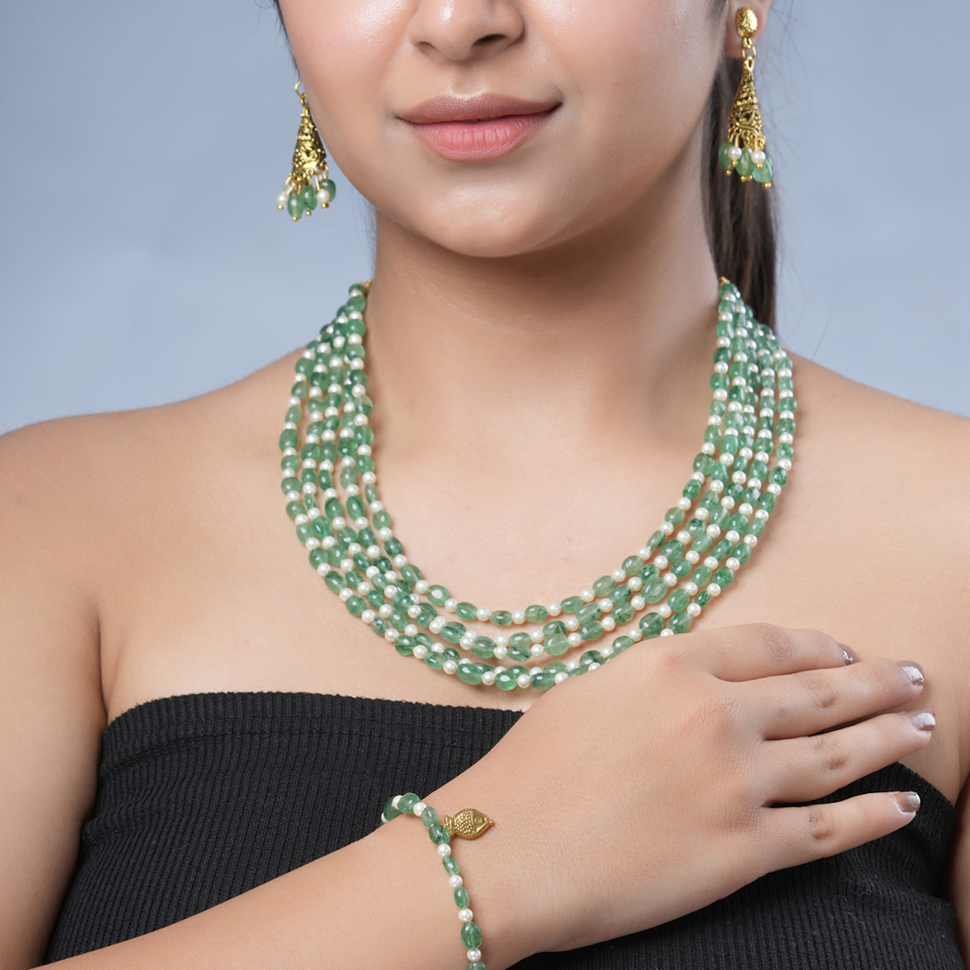 Girl model wearing Eykaa green strawberry quartz and shell pearls semi precious stone bracelet, earrings  and necklace.

Eykaa
stone jewellery
womens jewellery
earing for women
bracelet for women&nbsp;
necklace for women&nbsp;
jewellery stores