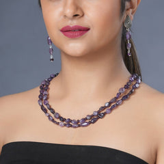  Girl model wearing Eykaa necklace and earrings that feature amethyst semi precious stone.    