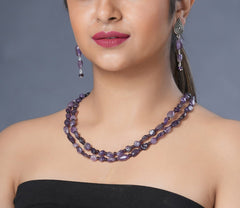 Girl model wearing Eykaa necklace and earrings that features semi precious stone  EYKAA AMETHYST TUMBLE LAYERED EARRINGS