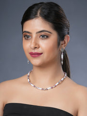 Girl model wearing Eykaa white howlite with dalmatian and silver charms semi precious stone necklace and earrings