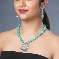 Girl model wearing Eykaa necklace and earrings that features semi precious stone EYKAA BLUE JADE BRACELET