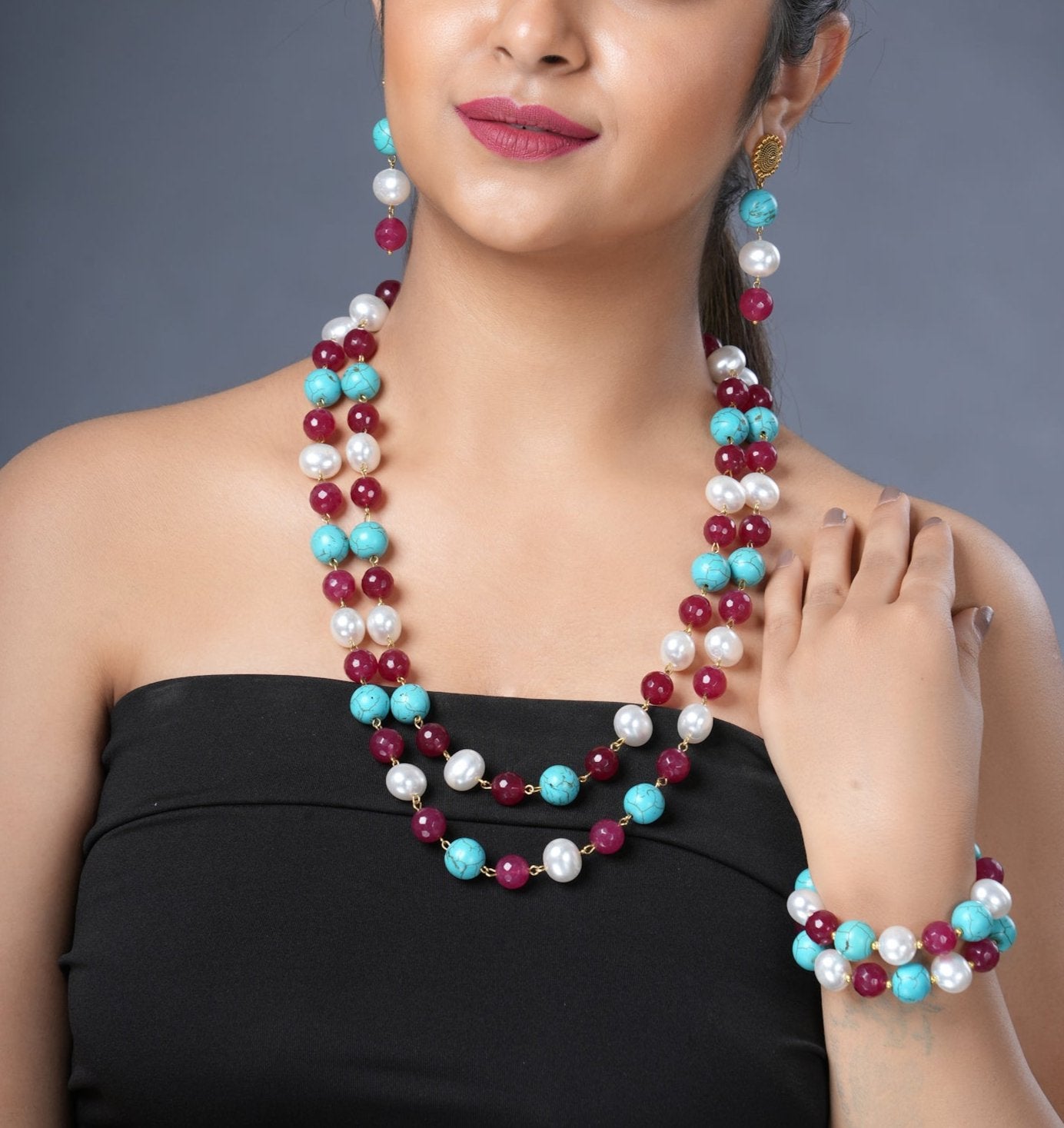 Girl Model Wearing Eykaa Firoza, Maroon Jade With Korean Pearl Ball Necklace With Earrings And A Bracelet.