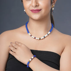 Girl Model Wearing Eykaa Blue Onyx, Rainbow Hematite, And Freshwater Pearl Necklace With Earrings And A Bracelet.