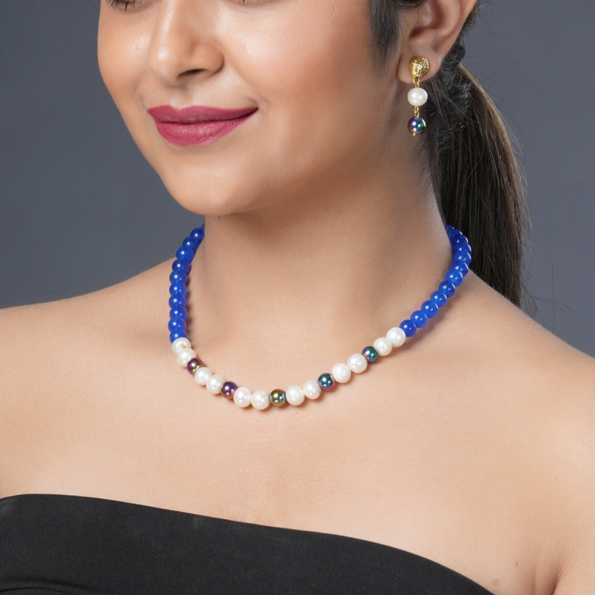 Girl Model Wearing Eykaa Blue Onyx, Rainbow Hematite, And Freshwater Pearl Necklace With Earrings.