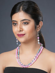 Girl model wearing Eykaa layered necklace and earrings that feature pink and multicoloured semi precious stone jade.