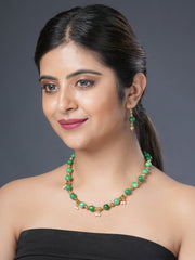 Girl model wearing Eykaa necklace and earrings that features semi precious stonGirl model wearing Eykaa necklace and earrings that features semi precious stone EYKAA GREEN JADE WITH SHELL PEARLS WITH GOLDEN BEADS BRACELET